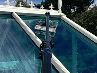 conservatory cleaning with extending arm brush