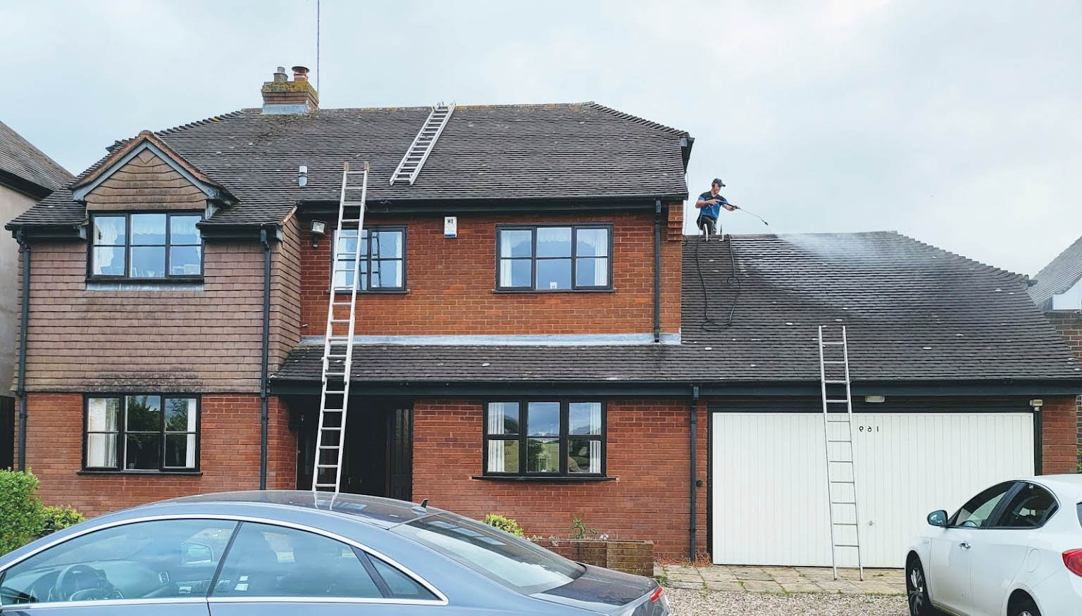 cleaning technician on roof